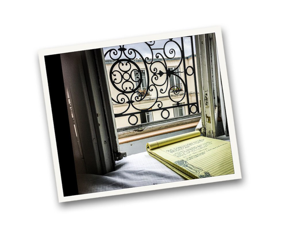 Writing pad looking outside in Paris, keeping a journal important in self mastery